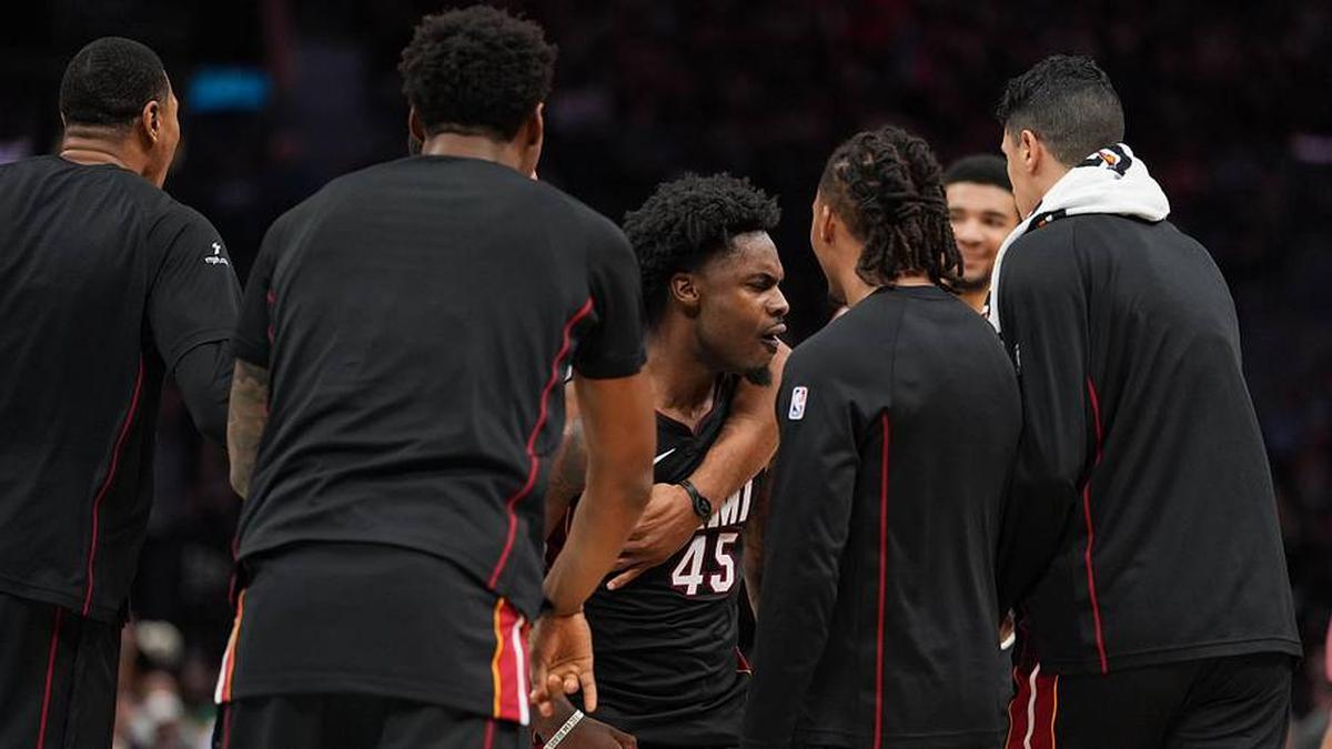  Apr 14, 2026; Charlotte, North Carolina, USA; Miami Heat guard Davion Mitchell (45) reacts with teammates over taking the lead during the second half during the play-in rounds between the Charlotte Hornets and the Miami Heat of the 2026 NBA Playoffs at Spectrum Center. Mandatory Credit: Jim Dedmon-Imagn Images | Jim Dedmon-Imagn Images 