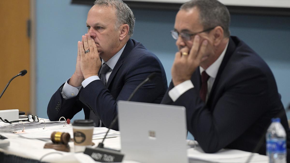 Richard Corcoran, the Commissioner of the Florida Department of Education sits next to Florida Department of Education Board Chair Andy Tuck as they listen to speakers during Thursday morning’s Florida Department of Education meeting. The board members of the Florida Department of Education met Thursday, June 10, 2021 at the Florida State College at Jacksonville’s Advanced Technology Center in Jacksonville, Fla. to take care of routine business but then held public comments before a vote to remove critical race theory from Florida classrooms. (Bob Self/The Florida Times-Union via AP)