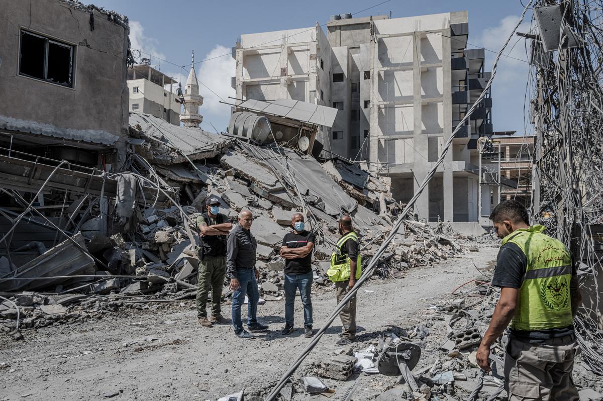 Civil defense workers and residents gather in the aftermath of an Israeli airstrike in Tyre, Lebanon, May 29, 2026. (Daniel Berehulak/The New York Times)