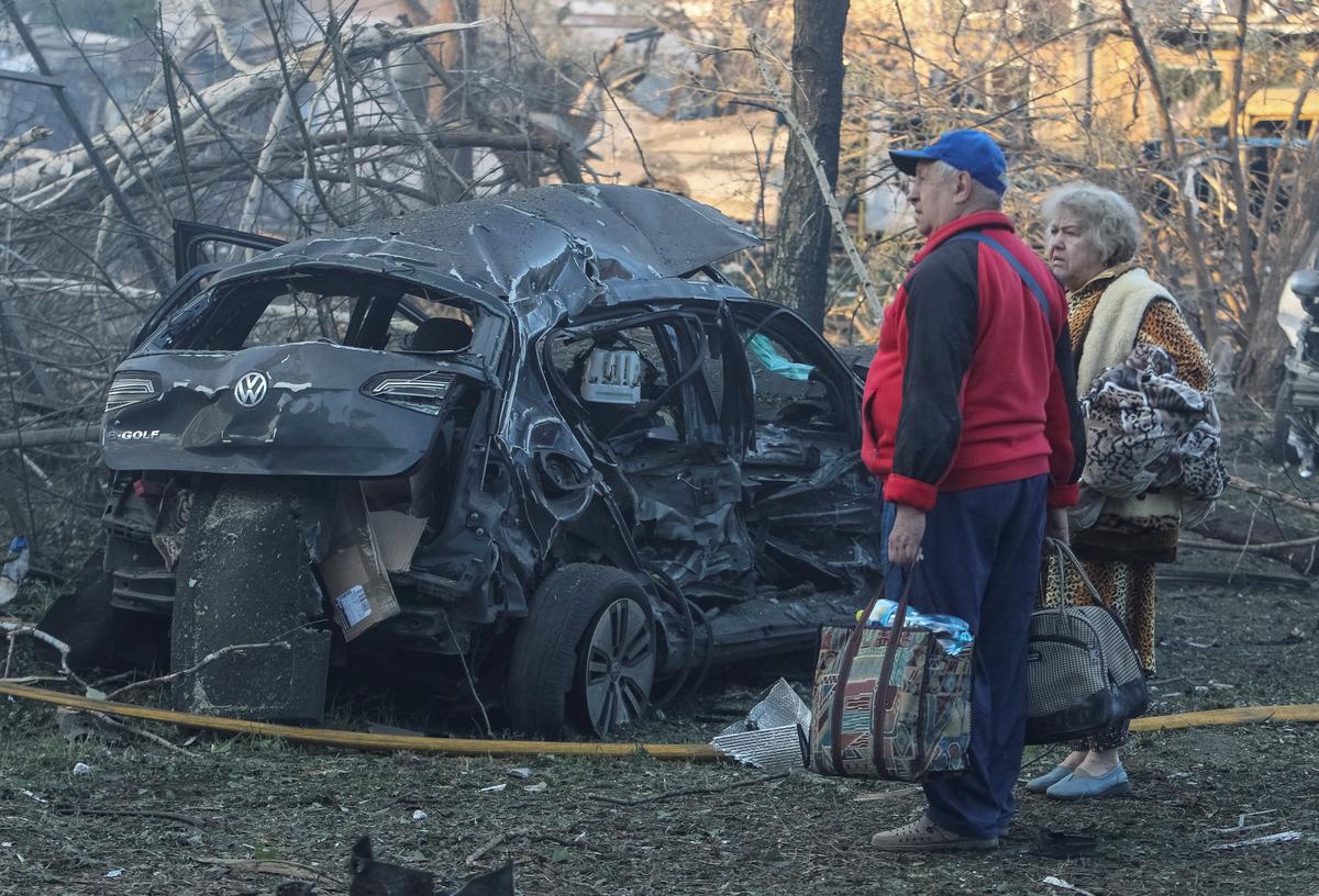 Residents stand at a site of a Russian drone and missile strike, amid Russia's attack on Ukraine, in Dnipro, Ukraine June 2, 2026. REUTERS/Stringer