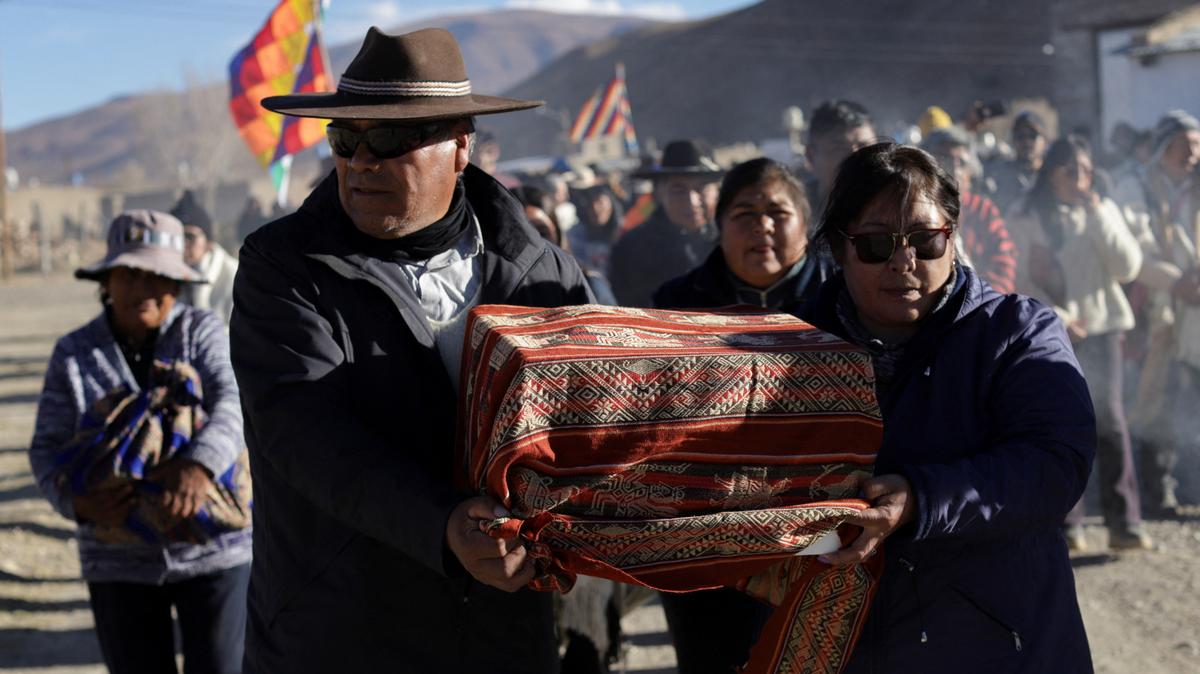 People participate in a ceremony following the return of the so-called “Child of Chani,” an Inca-era child mummy found frozen in 1905 at nearly 5,900 meters on a mountain, after being returned to a local indigenous community following about 120 years in a Buenos Aires museum, El Moreno, in Jujuy province, Argentina May 28, 2026. REUTERS/Gianni Bulacio