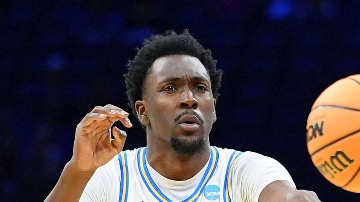  Mar 20, 2026; Philadelphia, PA, USA; UCLA Bruins center Xavier Booker (1) makes a pass against the UCF Knights in the first half during a first round game of the men's 2026 NCAA Tournament at Xfinity Mobile Arena. Mandatory Credit: Kyle Ross-Imagn Images | Kyle Ross-Imagn Images 