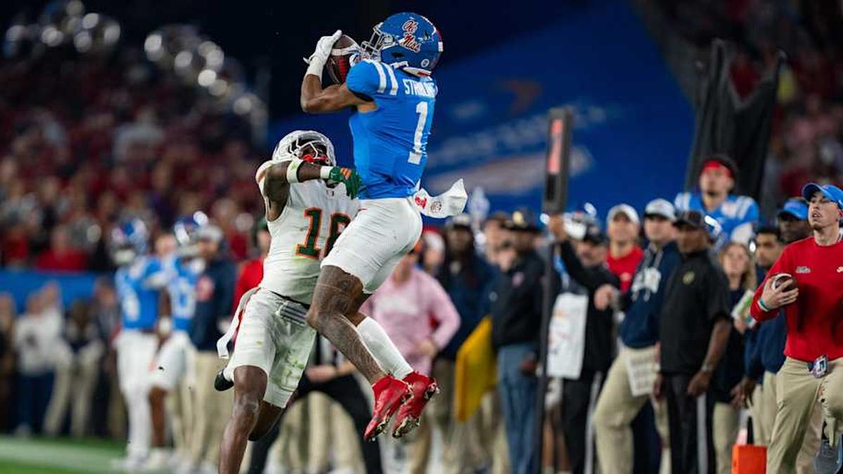  Ole Miss wide receiver De'Zhaun Stribling (1) catches the ball before being tackled by Miami Hurricanes defensive back Ja'boree Antoine (16) and dropping it during the CFP Fiesta Bowl at the State Farm Stadium, in Glendale, Ariz., on Thursday, Jan. 8, 2026. | Lauren Witte/Clarion Ledger / USA TODAY NETWORK via Imagn Images 