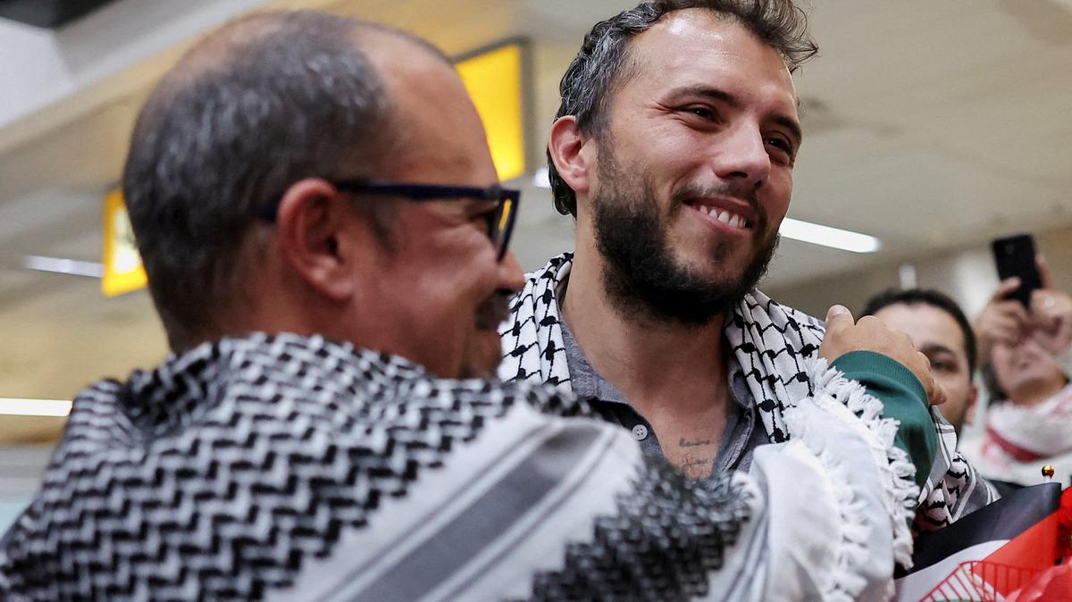Brazilian activist Thiago Avila, who was detained aboard the Gaza-bound Global Sumud Flotilla, which was intercepted by Israeli forces, is embraced as he arrives at Sao Paulo/Guarulhos International Airport after being deported, in Guarulhos, Brazil, May 11, 2026. REUTERS/Amanda Perobelli