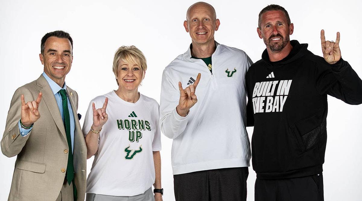  From left, USF CEO of athletics Rob Higgins is seen with women's basketball coach Kristy Curry, men's basketball coach Chris Mack and football coach Brian Hartline. USF athletics photo