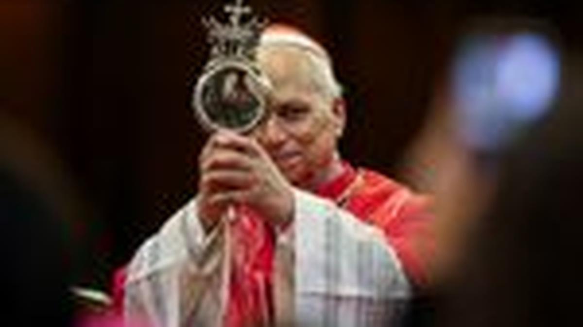 Pope Leo XIV venerates the reliquary containing ampoules of what local Roman Catholics believe is the blood of St. Gennaro at the Naples Cathedral during a meeting with members of the clergy on the day of the first anniversary of his election, in Naples, Italy, May 8, 2026. REUTERS/Yara Nardi