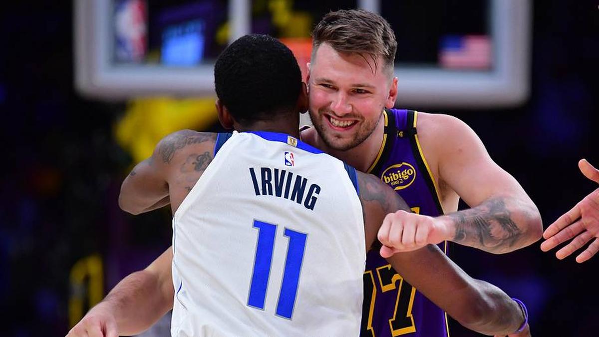  Feb 25, 2025; Los Angeles, California, USA; Los Angeles Lakers guard Luka Doncic (77) reacts with Dallas Mavericks guard Kyrie Irving (11) during the first quarter at Crypto.com Arena. Mandatory Credit: Gary A. Vasquez-Imagn Images | Gary A. Vasquez-Imagn Images 