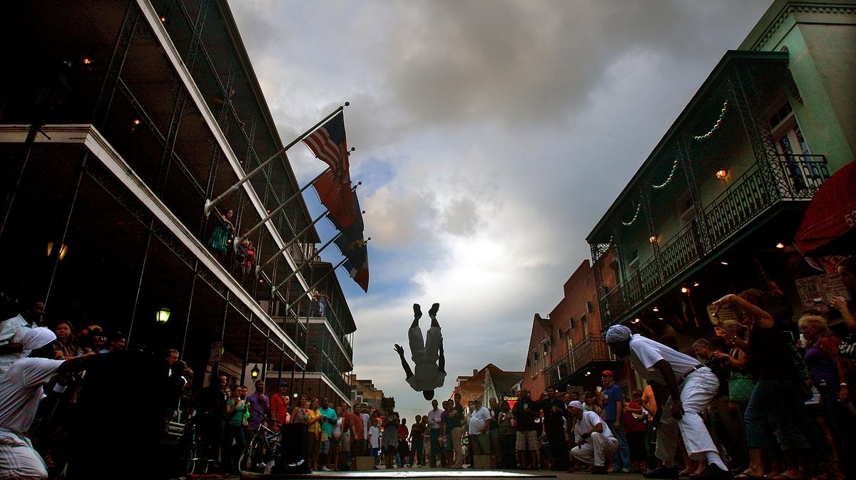 A street performer flips for the crowd on Bourbon Street in the French Quarter May 15, 2009, in New Orleans, Louisiana. (Mario Tama/Getty Images/TNS)