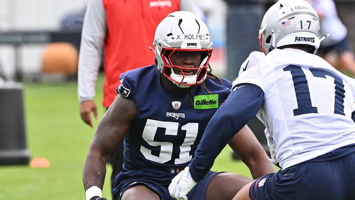  May 9, 2026; Foxborough, MA, USA; New England Patriots defensive end Xavier Holmes (51) does a drill with tight end Jeremiah Franklin (17) during the New England Patriots rookie camp at Gillette Stadium. Mandatory Credit: Eric Canha-Imagn Images | Eric Canha-Imagn Images 