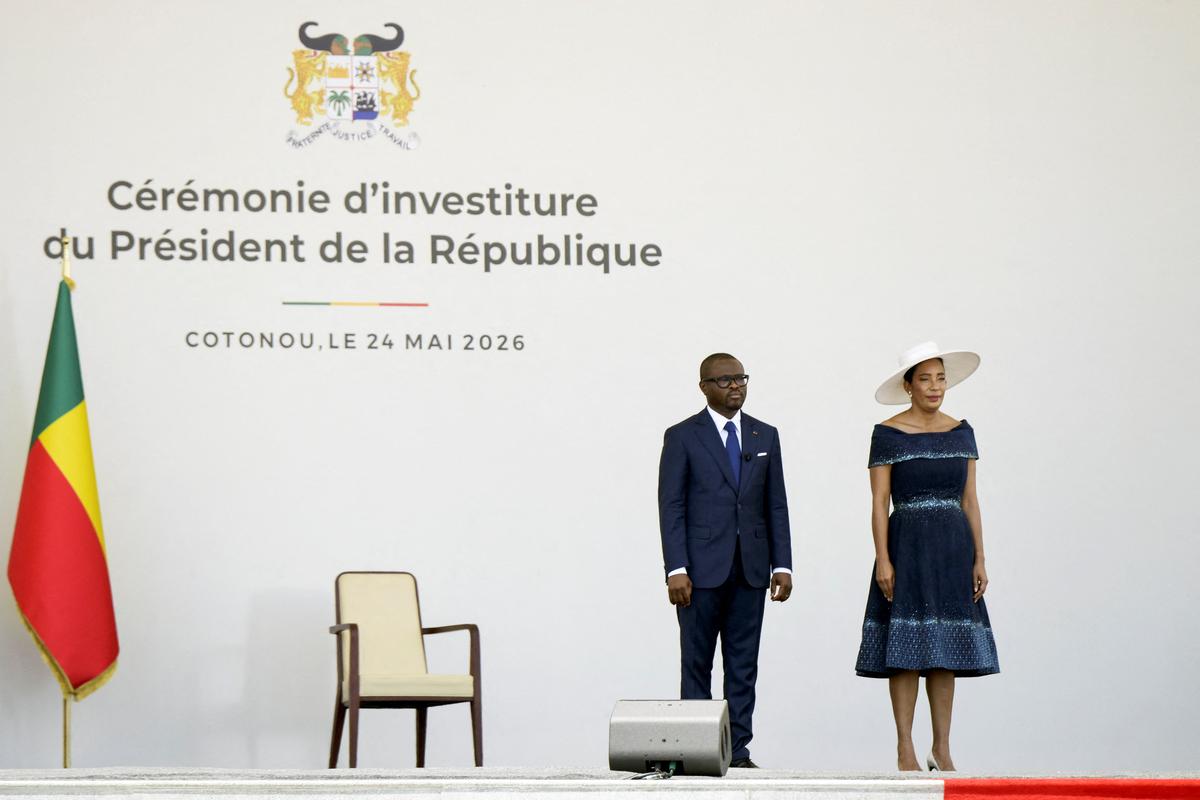 Benin's former finance minister Romuald Wadagni, newly elected Benin president, stands next to his wife Nathalie Villette-Wadagni, during the inauguration ceremony at the Palace of Congress in Cotonou, Benin, May 24, 2026. REUTERS/Charles Placide Tossou