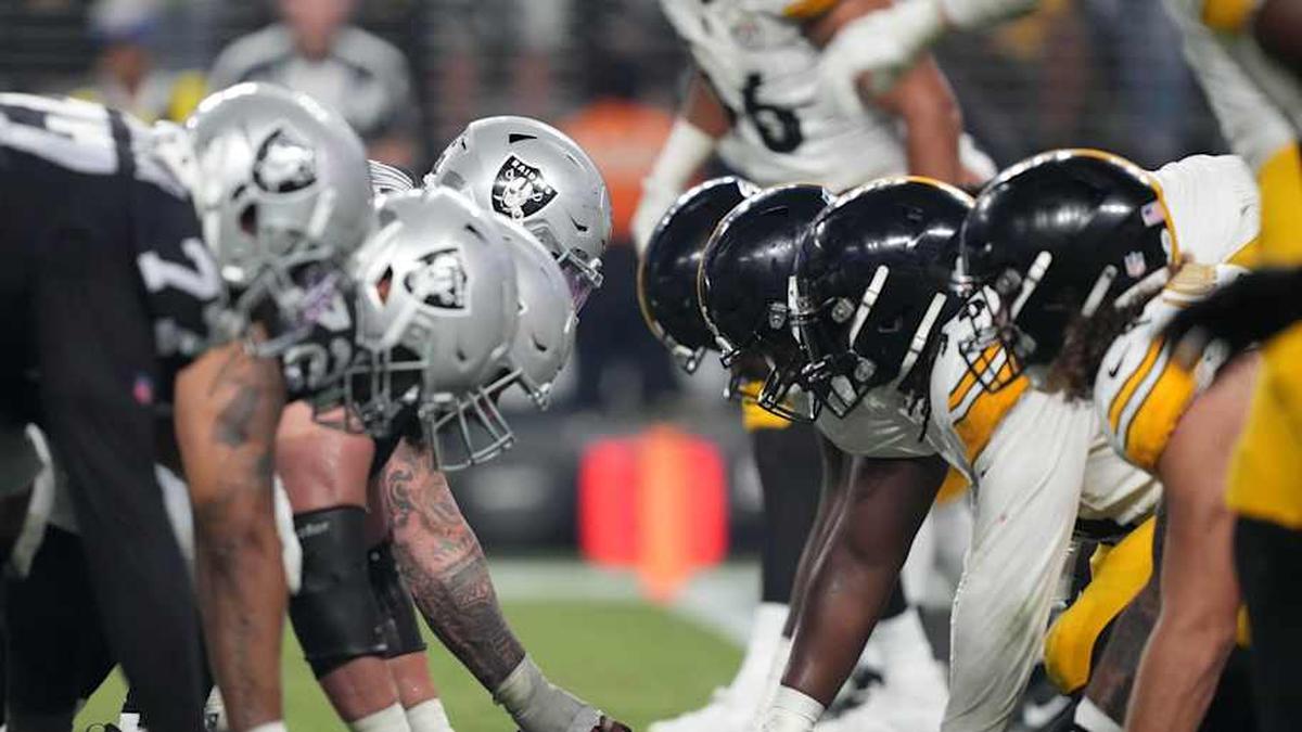  Sep 24, 2023; Paradise, Nevada, USA; A general overall ivew of helmets at the line of scrimmage as Las Vegas Raiders center Andre James (68) snaps the ball against the Pittsburgh Steelers at Allegiant Stadium. Mandatory Credit: Kirby Lee-Imagn Images | Kirby Lee-Imagn Images 