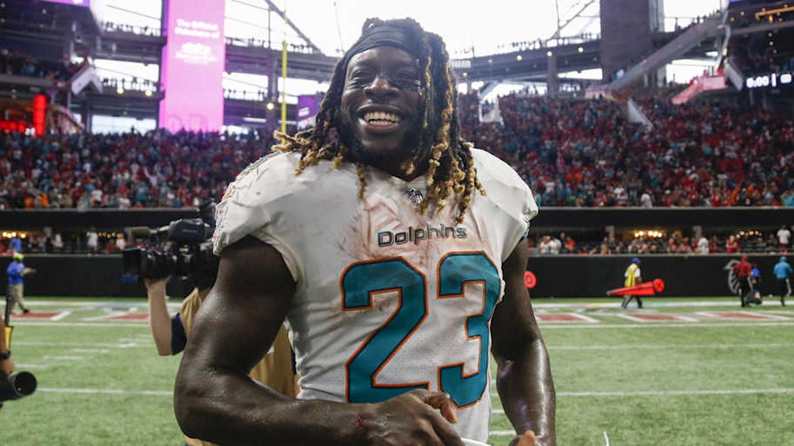  Miami Dolphins running back Jay Ajayi (23) shows emotion after a victory against the Atlanta Falcons at Mercedes-Benz Stadium in 2017. | Brett Davis-Imagn Images 