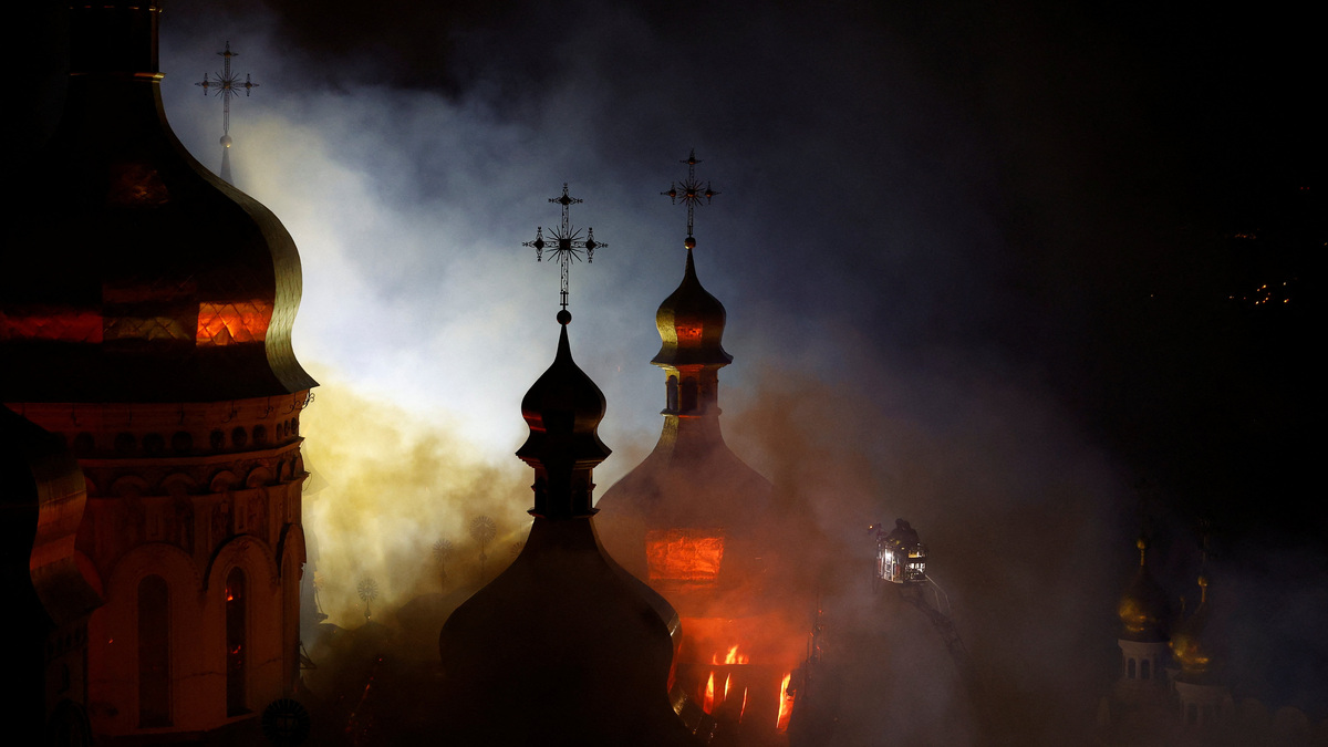 The Dormition Cathedral of the Kyiv Pechersk Lavra burns after it was hit during Russian missile and drone strikes, amid Russia's attack on Ukraine, in Kyiv, Ukraine June 15, 2026. REUTERS/Valentyn Ogirenko
