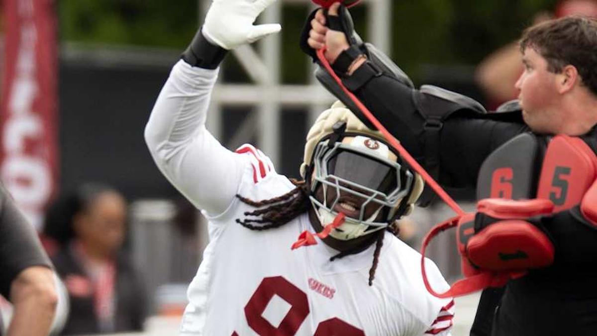 Jul 24, 2025; Santa Clara, CA, USA; San Francisco 49ers defensive tackle CJ West (99) swats at a ball during a pass rushing drill on the second day of training camp. Mandatory Credit: D. Ross Cameron-Imagn Images | D. Ross Cameron-Imagn Images 