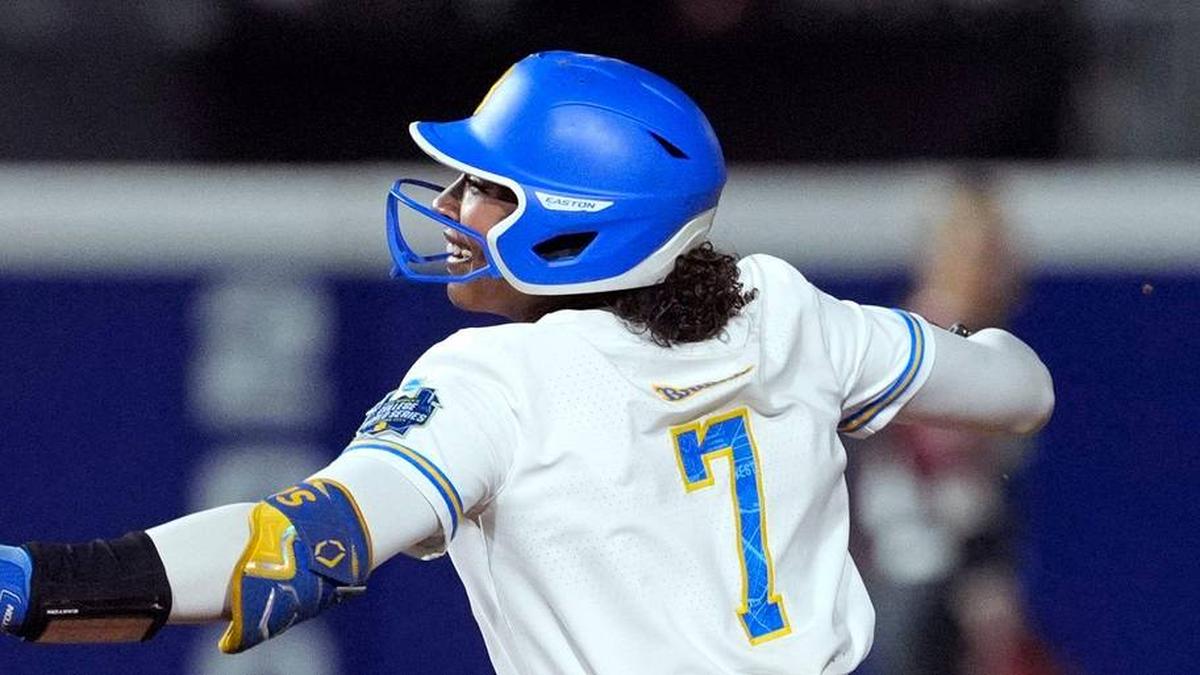  UCLA Bruins utility Jolyna Lamar (7) celebrates beside Arkansas Razorbacks infielder Atalyia Rijo (26) after hitting a home run in the fifth inning of a Women's College World Series softball game between the UCLA Bruins and the Arkansas Razorbacks at Devon Park in Oklahoma City, Friday, May 29, 2026. | BRYAN TERRY/THE OKLAHOMAN / USA TODAY NETWORK via Imagn Images 