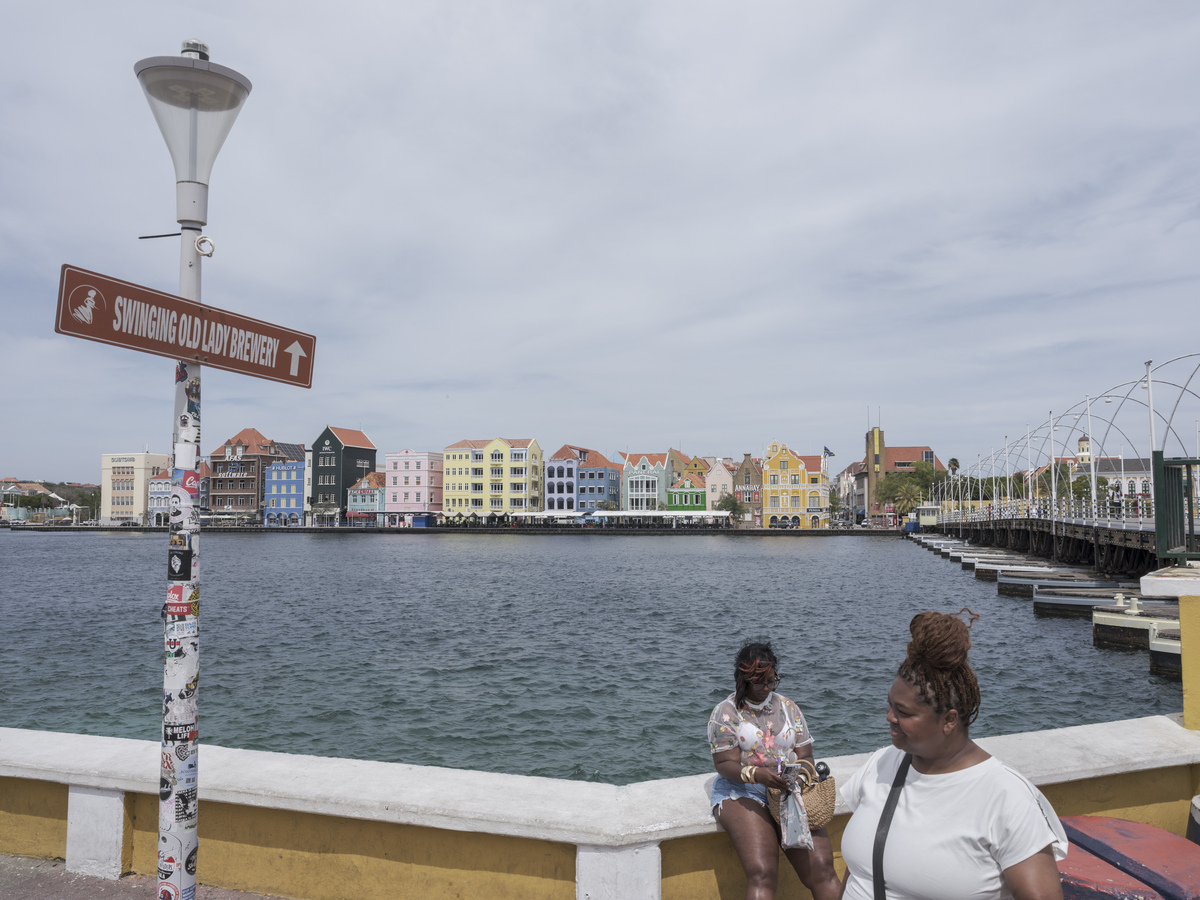 Dutch colonial buildings on the waterfront in Willemstad Bay in Curacao, June 5, 2026. The pandemic greatly damaged tourism to the island, but Sithree van Heydoorn, Curacao's minister of education, science, culture and sports, says it is rebounding. (Luis Antonio Rojas/The New York Times)