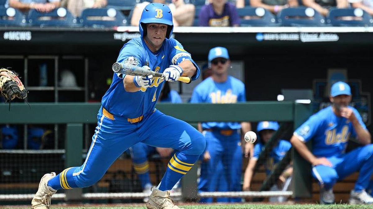  Jun 14, 2025; Omaha, Neb, USA; UCLA Bruins shortstop Roch Cholowsky (1) bunts in a run against the Murray State Racers during the fourth inning at Charles Schwab Field. Mandatory Credit: Steven Branscombe-Imagn Images | Steven Branscombe-Imagn Images 