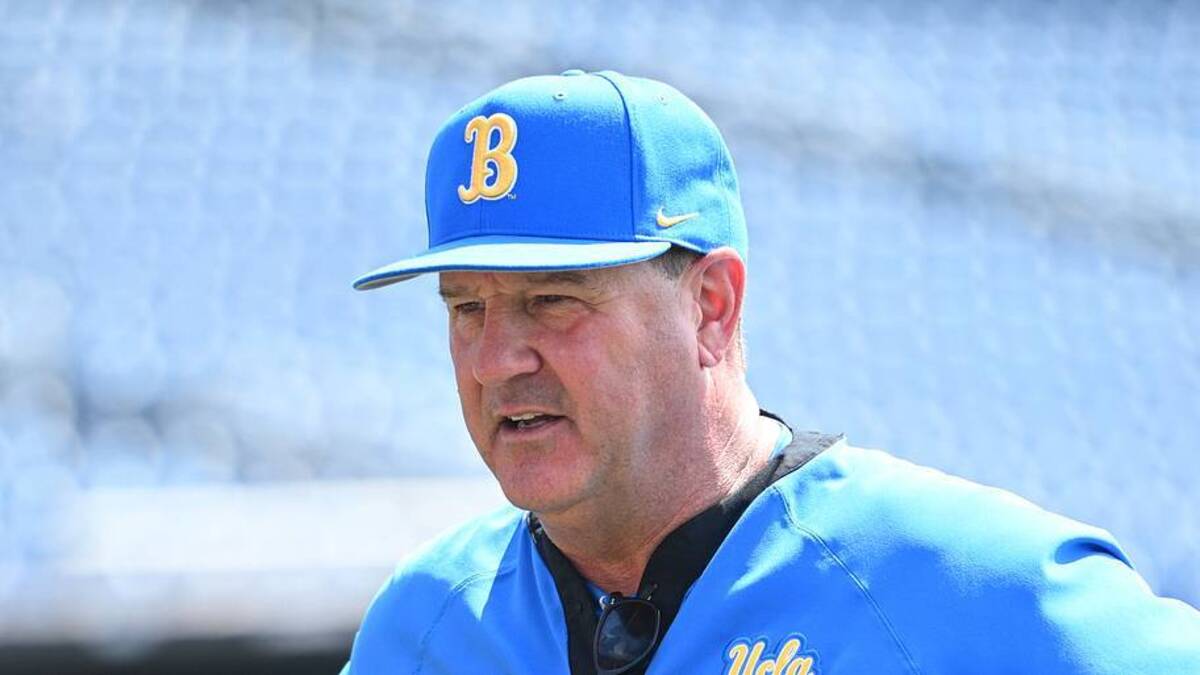  Jun 14, 2025; Omaha, Neb, USA; UCLA Bruins head coach John Savage on the field before the game against the Murray State Races at Charles Schwab Field. Mandatory Credit: Steven Branscombe-Imagn Images | IMAGN IMAGES via Reuters Connect 