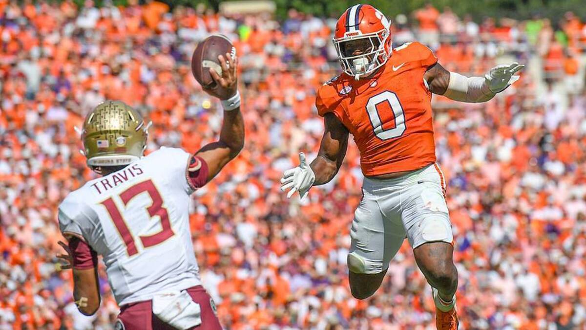  Sep 23, 2023; Clemson, South Carolina, USA; Clemson Tigers linebacker Barrett Carter (0) pressures Florida State Seminoles quarterback Jordan Travis (13) during the fourth quarter at Memorial Stadium. Mandatory Credit: Ken Ruinard-Imagn Images | Ken Ruinard-Imagn Images 