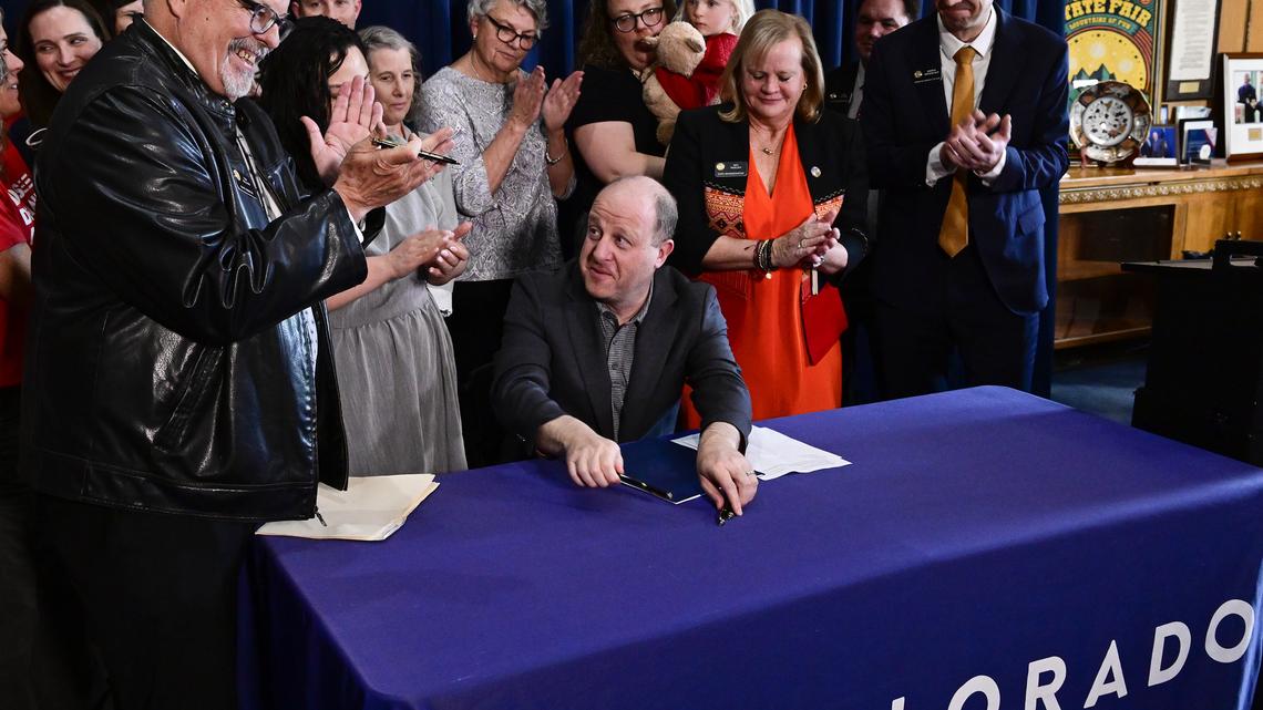 Colorado Gov. Jared Polis signs expansion of red flag law, allowing more people to seek gun removals 