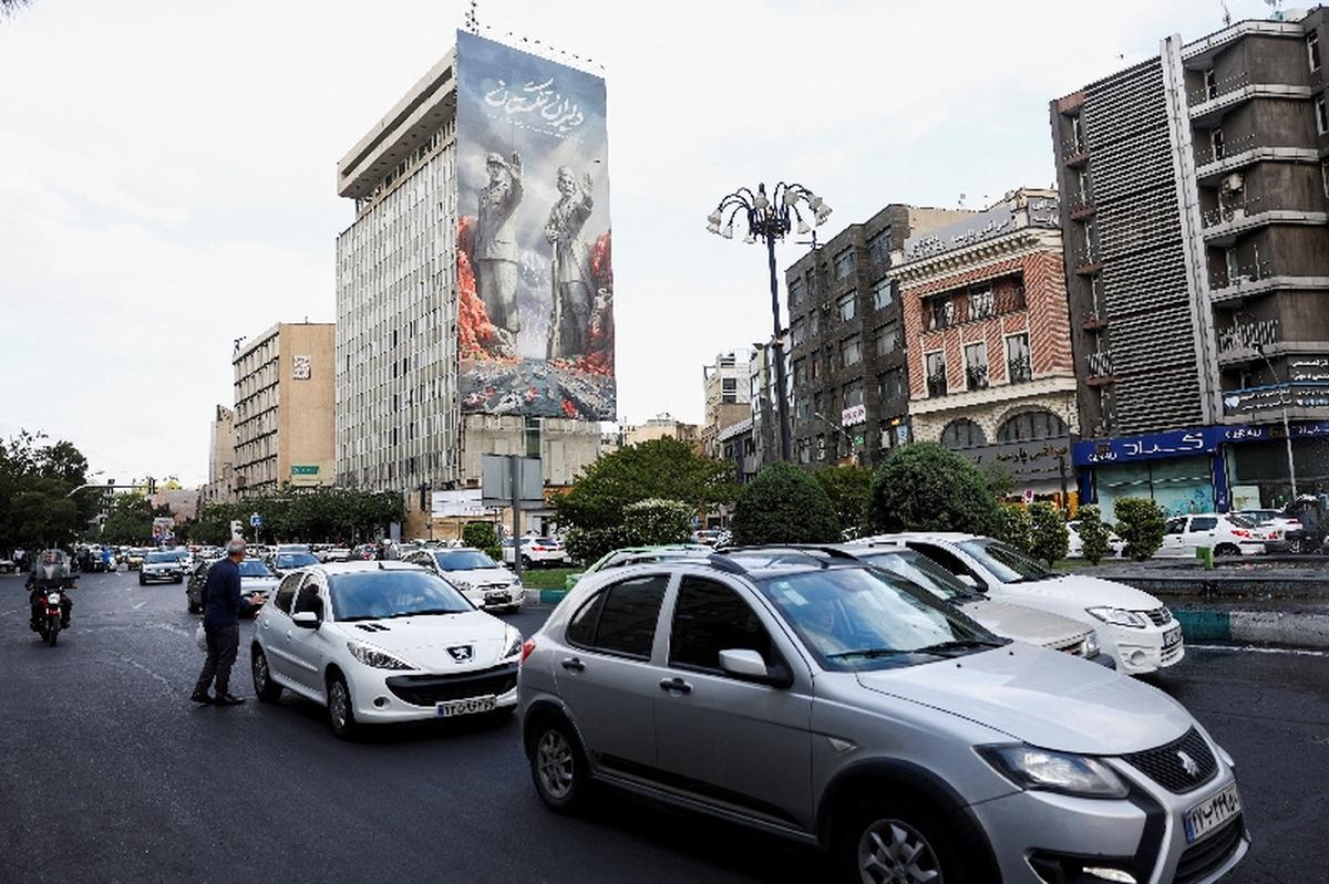 People drive past a billboard about the Strait of Hormuz, in Tehran, Iran, May 17, 2026. Majid Asgaripour/WANA (West Asia News Agency) via REUTERS