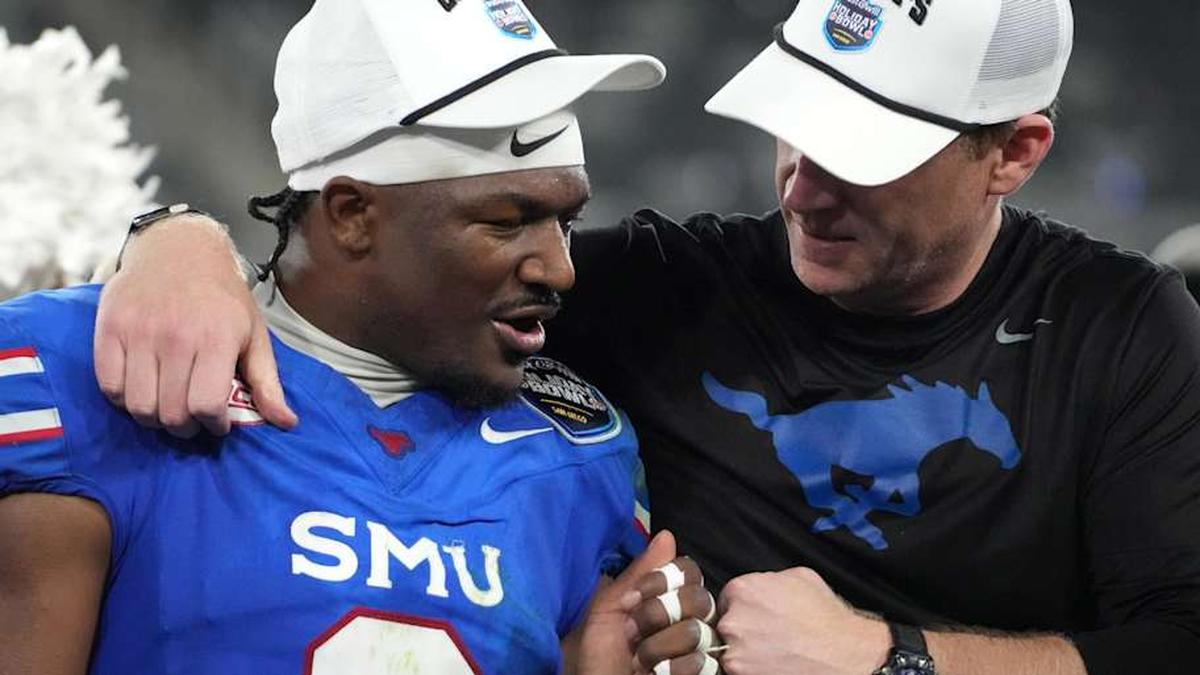  Jan 2, 2026; San Diego, CA, USA; SMU Mustangs safety Ahmaad Moses (3) and head coach Rhett Lashlee celebrate after victory over the Arizona Wildcats in the Holiday Bowl at Snapdragon Stadium. Mandatory Credit: Kirby Lee-Imagn Images | Kirby Lee-Imagn Images 