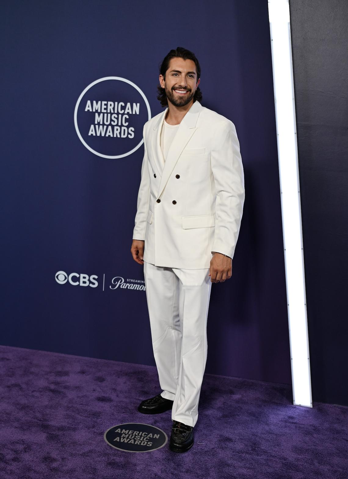 Jason Tartick Bachelor Nation's Jason Tartick went with a classy all-white look for his red carpet appearance. Denise Truscello/WireImage