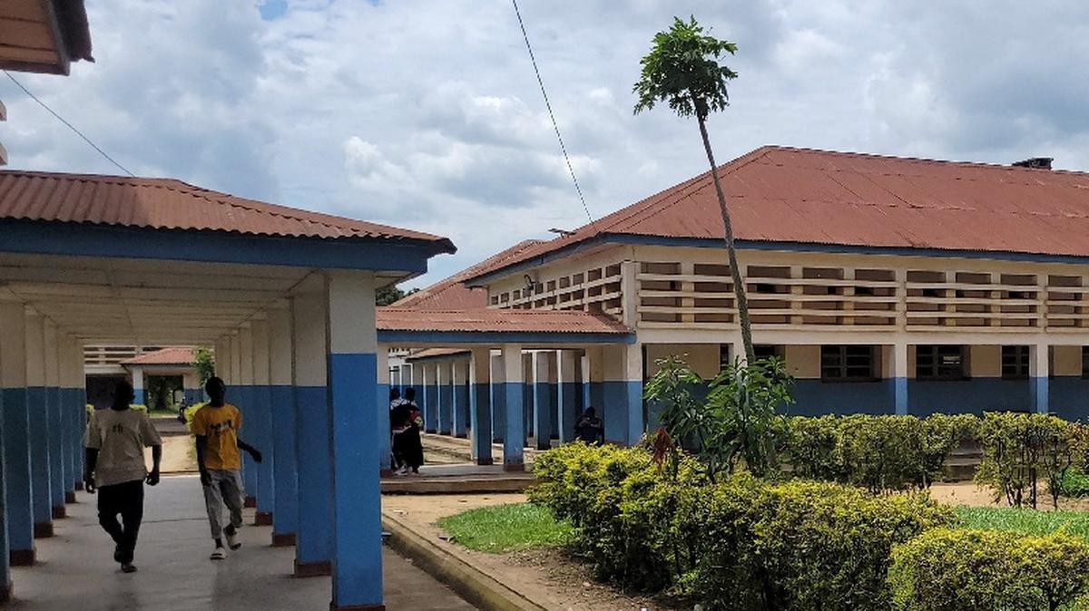 People walk at Bunia General Referral Hospital following confirmation of an Ebola outbreak involving the Bundibugyo strain in Bunia, Ituri province, Democratic Republic of Congo, May 16, 2026. REUTERS/Victoire Mukenge