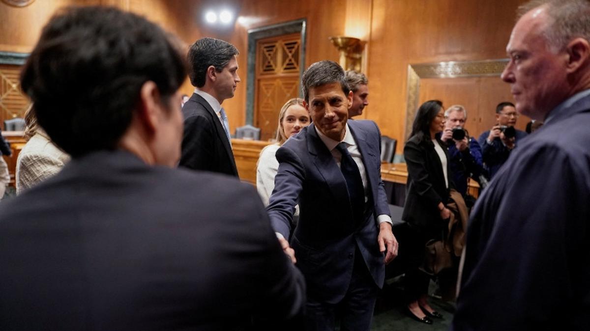 Kevin Warsh, U.S. President Donald Trump's nominee to be next chair of the Federal Reserve, shakes hands with a person, after Warsh testified at a Senate Banking Committee confirmation hearing, on Capitol Hill in Washington, D.C., U.S., April 21, 2026. REUTERS/Elizabeth Frantz