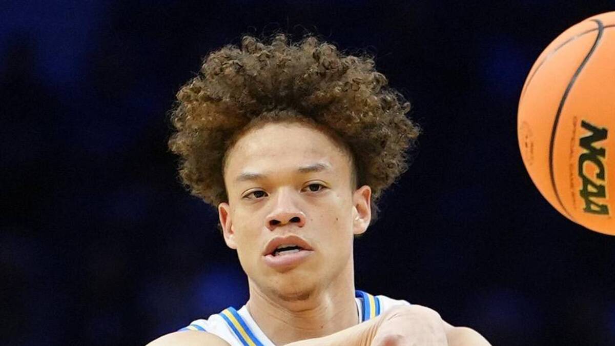  Mar 20, 2026; Philadelphia, PA, USA; UCLA Bruins guard Trent Perry (0) makes a pass against the UCF Knights in the first half during a first round game of the men's 2026 NCAA Tournament at Xfinity Mobile Arena. Mandatory Credit: Kyle Ross-Imagn Images | Kyle Ross-Imagn Images 