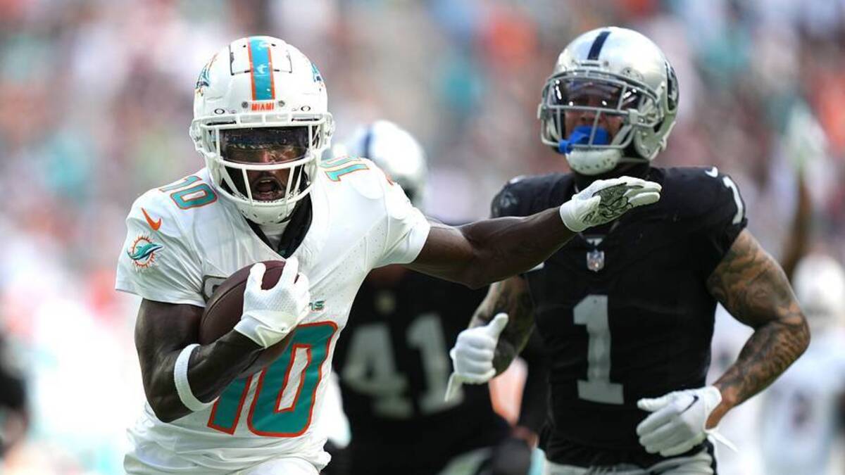  Miami Dolphins wide receiver Tyreek Hill (10) runs past Las Vegas Raiders safety Marcus Epps (1) and scores a touchdown during the first half of an NFL game at Hard Rock Stadium in Miami Gardens, Nov. 19, 2023. | Jim Rassol / USA TODAY NETWORK 