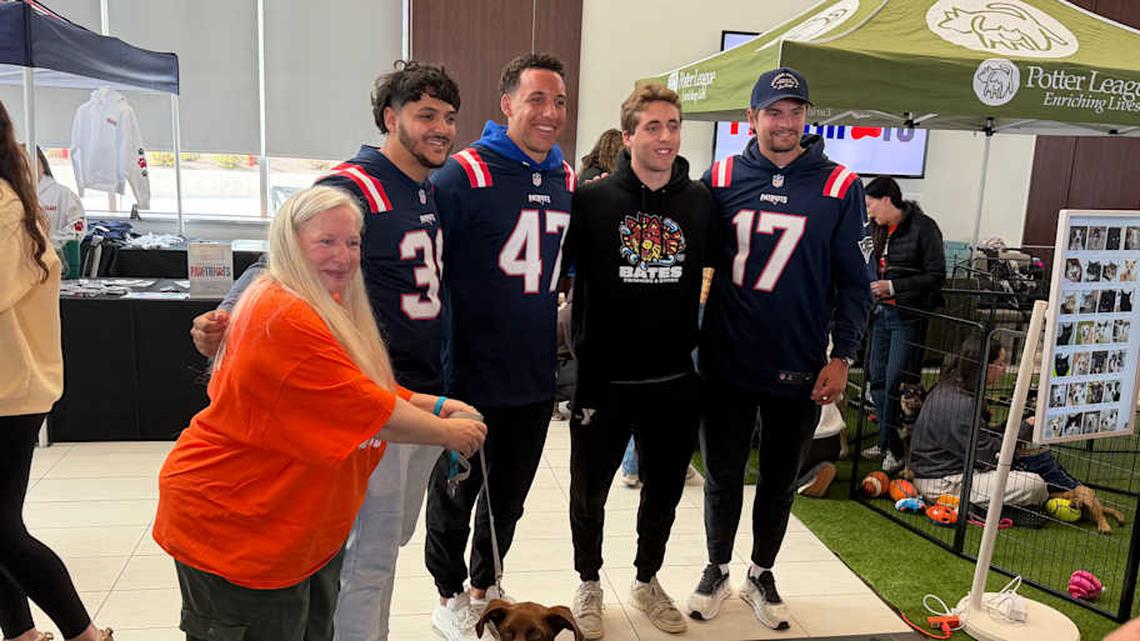  New England Patriots specialists Andy Borregales, Julian Ashby and Bryce Baringer pose for a photo at the team's dog adoption event. | Ethan Hurwitz / Patriots On SI 