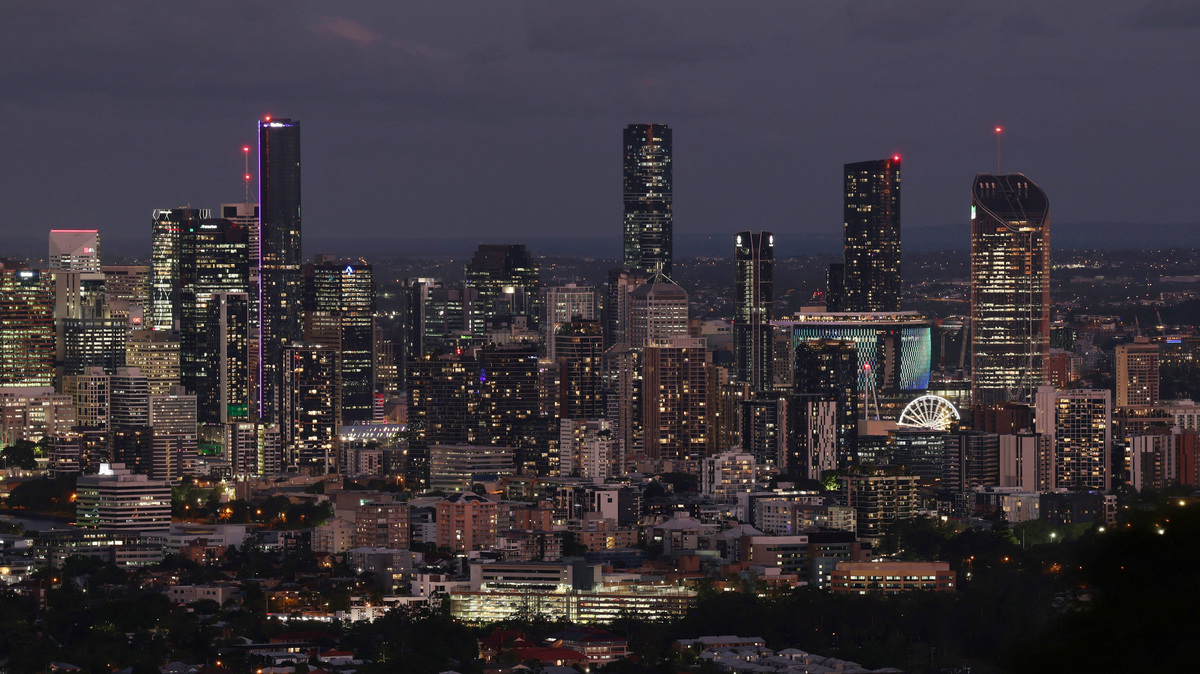 Buildings light up across city skyline at dusk in Brisbane, Australia, December 8, 2025. REUTERS/Hollie Adams
