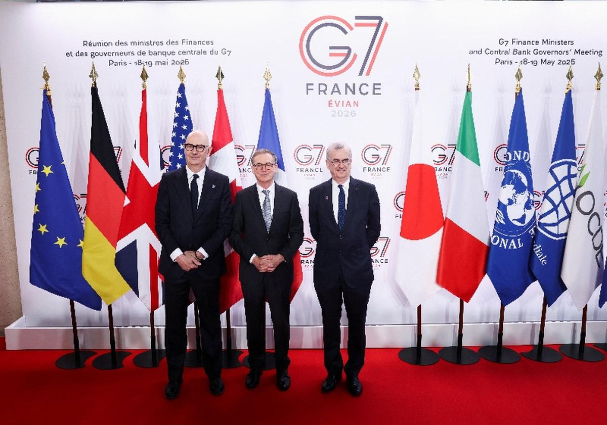 French Finance Minister Roland Lescure, Governor of the Bank of Canada Tiff Macklem, and Governor of Banque de France Francois Villeroy de Galhau pose for a photo ahead of a G7 finance ministers and central bank governors meeting in Paris, France, May 18, 2026. REUTERS/Tom Nicholson