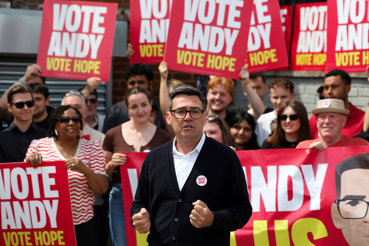 Greater Manchester mayor and Labour candidate Andy Burnham meets with supporters during the Makerfield by-election, triggered by the resignation of Labour MP John Simons, in Wigan, Britain, June 18, 2026. REUTERS/Temilade Adelaja