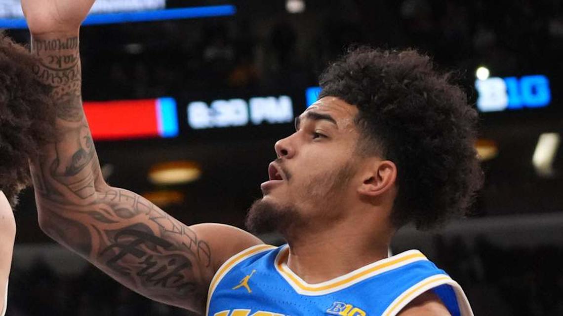  Mar 13, 2026; Chicago, IL, USA; UCLA Bruins guard Eric Freeny (8) defends Michigan State Spartans forward Coen Carr (55) during the first half at United Center. Mandatory Credit: David Banks-Imagn Images | David Banks-Imagn Images 