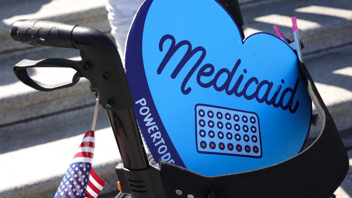 A sign in support of Medicaid rests in a walking device during a protest on April 27 in Washington, D.C.