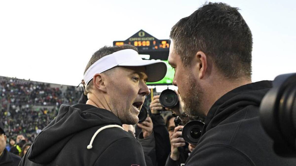  Nov 22, 2025; Eugene, Oregon, USA; Southern California Trojans head coach Lincoln Riley and Oregon Ducks head coach Dan Lanning greet each other after the game at Autzen Stadium. Mandatory Credit: Troy Wayrynen-Imagn Images | Troy Wayrynen-Imagn Images 