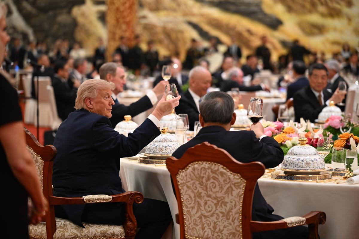 President Donald Trump takes part in a state banquet at the Great Hall of the People in Beijing during his two-day summit with President Xi Jinping of China, on Thursday, May 14, 2026. Crispy beef ribs, roast duck and tiramisu were on the menu Thursday at the state dinner, as Chinese chefs sought to appeal to Trump's culinary preferences while using traditional ingredients and cooking techniques. (Kenny Holston/The New York Times)..