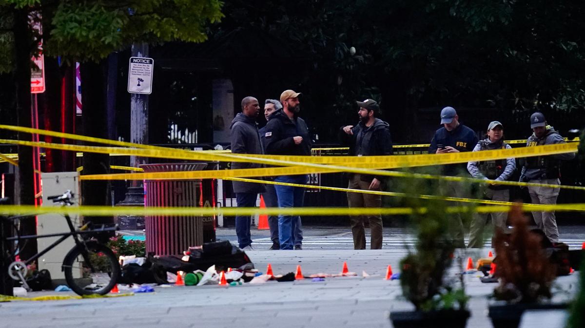 FBI agents stand in a cordoned-off area near the White House after a shooting incident in Washington, D.C., U.S., May 23, 2026. REUTERS/Nathan Howard