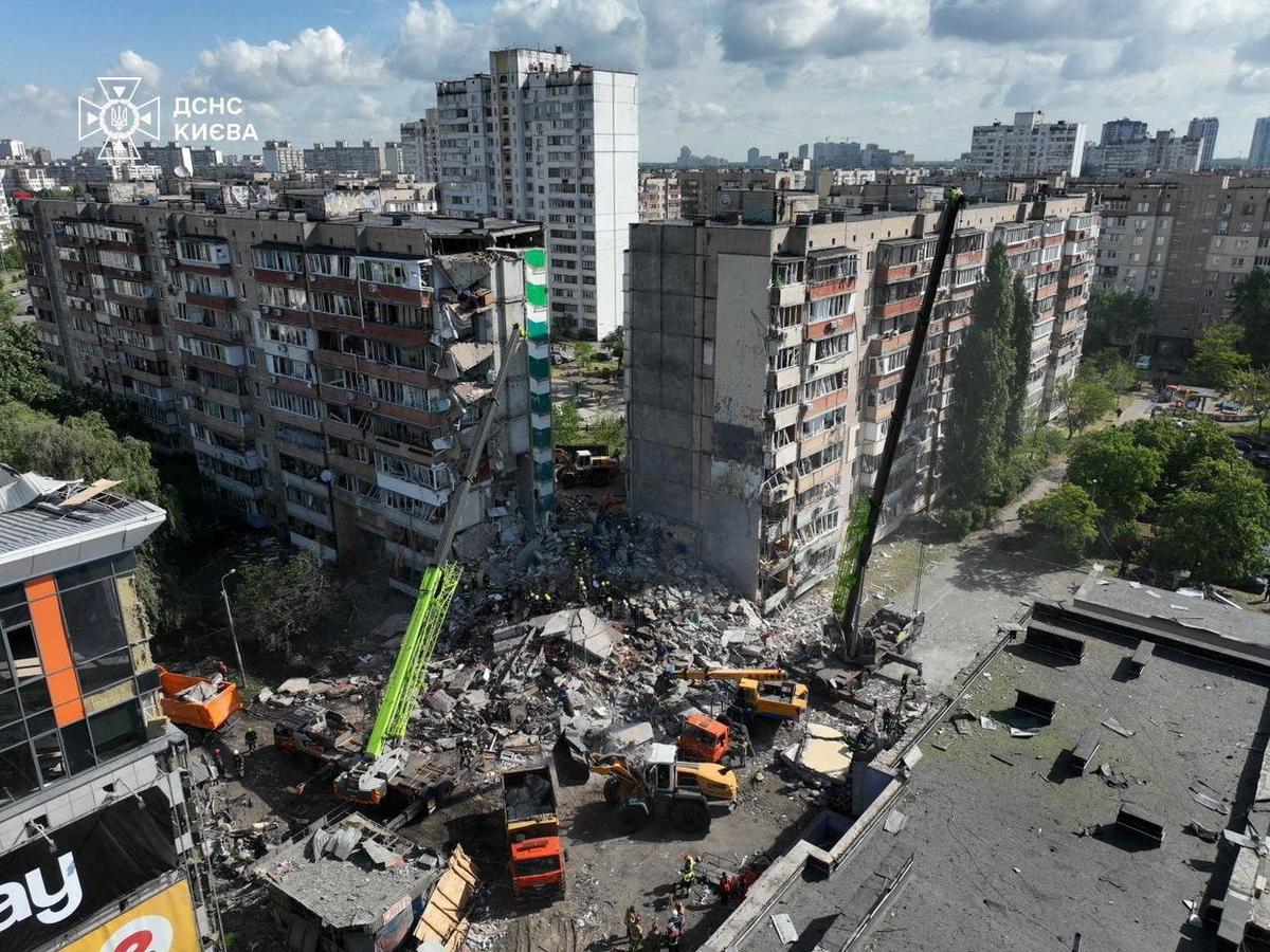 Firefighters work at a site of the apartment building damaged during a Russian missile and drone strike, amid Russia's attack on Ukraine, in Kyiv, Ukraine in this handout picture released May 14, 2026. Press service of the State Emergency Service of Ukraine in Kyiv/Handout via REUTERS