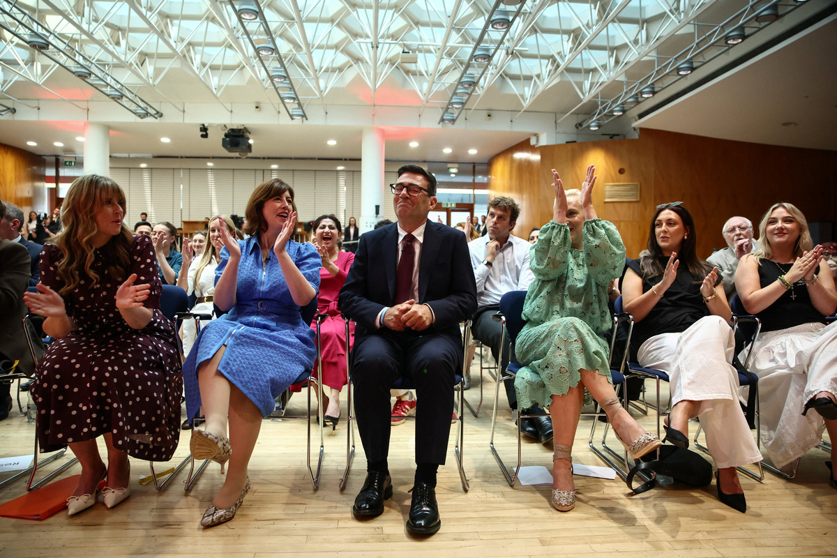 Andy Burnham smiles next to his wife Marie-France van Heel and family as he is confirmed as the Labour Party's new leader and the country's next Prime Minister, during 'Labour's Special Conference' in London, Britain, July 17, 2026. HENRY NICHOLLS/Pool via REUTERS