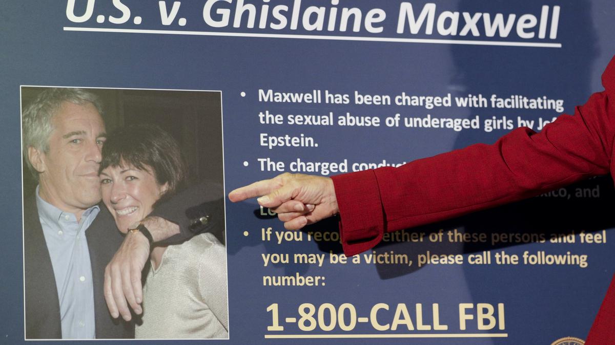 Audrey Strauss, the acting U.S. attorney for the Southern District of New York, points to a photo of Jeffrey Epstein and Ghislaine Maxwell during a news conference in New York, July 2, 2020.