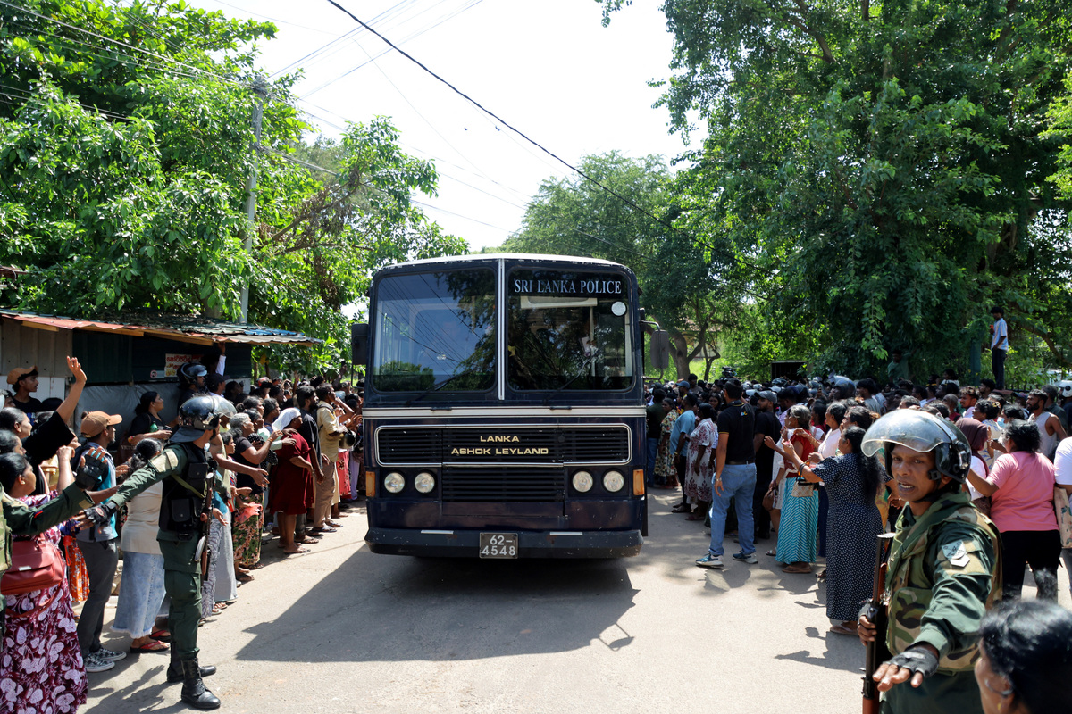 Members of security forces make way for a bus carrying prisoners to be transferred to another prison following clashes between two groups of inmates at Negombo Prison, in the coastal town of Negombo, Sri Lanka, July 6, 2026. REUTERS/Lahiru Harshana