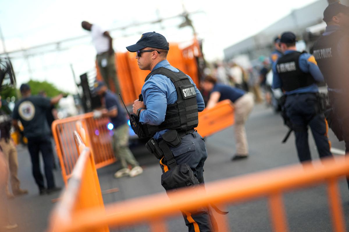 New Jersey State Policemen set up a protest zone outside the Delaney Hall detention center, as demonstrators remain gathered outside, in Newark, New Jersey, U.S., May 29, 2026. REUTERS/Eduardo Munoz