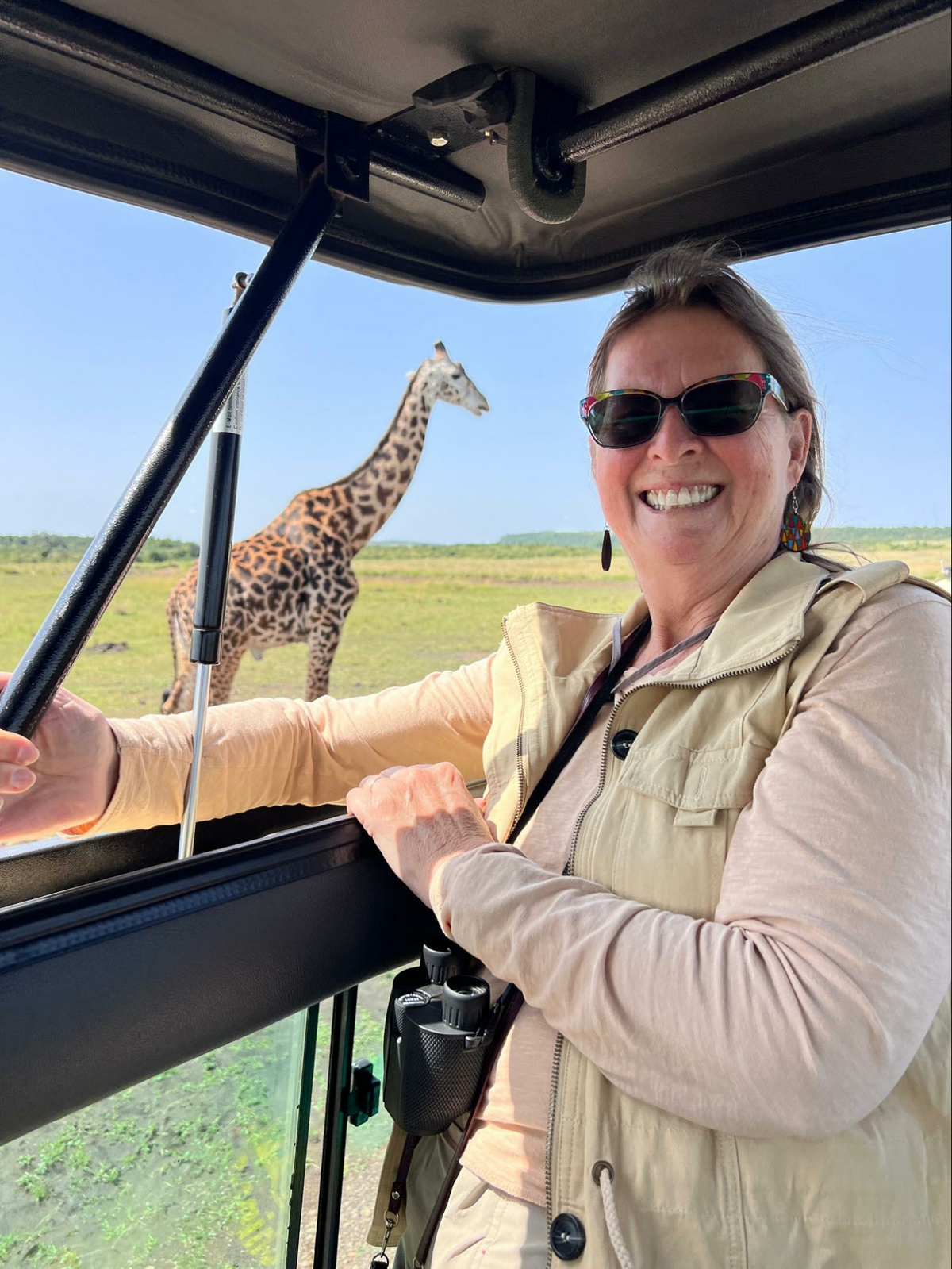 Not all of the animals are as courteous as this giraffe, which posed close to our safari truck. Bring binoculars so you can get a closer look at the ones who are more stand-offish. Photo credit: Deb Thompson