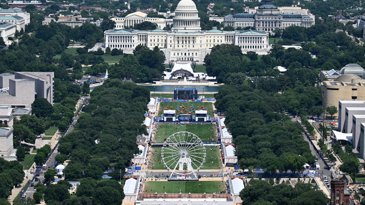 The Ferris wheel is seen with the U.S. Capitol in the distance during the "Great American State Fair," as seen from the Washington Monument on the National Mall, in Washington, D.C., on June 30, 2026. (Alex Wroblewski/AFP/Getty Images/TNS)