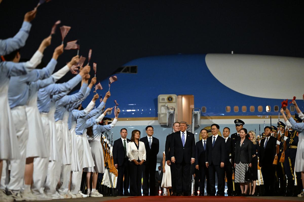 President Donald Trump, center, arrives at Beijing Capital International Airport in Beijing, China, on Wednesday, May 13, 2026, for a two-day summit with China's leader, Xi Jinping. (Kenny Holston/The New York Times)