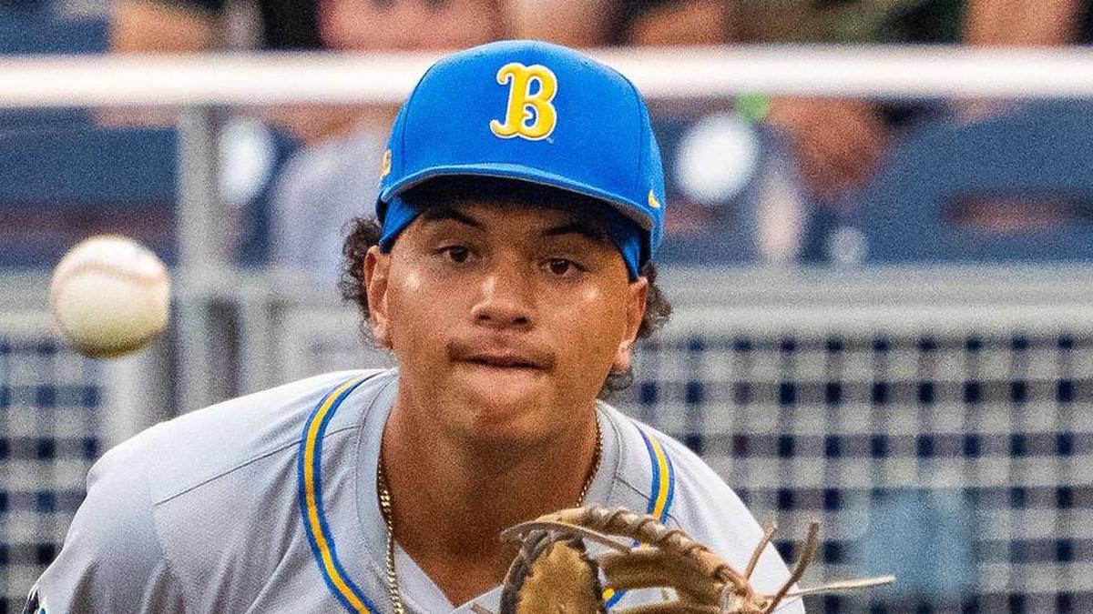  Jun 17, 2025; Omaha, Neb, USA; UCLA Bruins first baseman Mulivai Levu (39) catches for an out against the Arkansas Razorbacks during the first inning at Charles Schwab Field. Mandatory Credit: Dylan Widger-Imagn Images | Dylan Widger-Imagn Images 