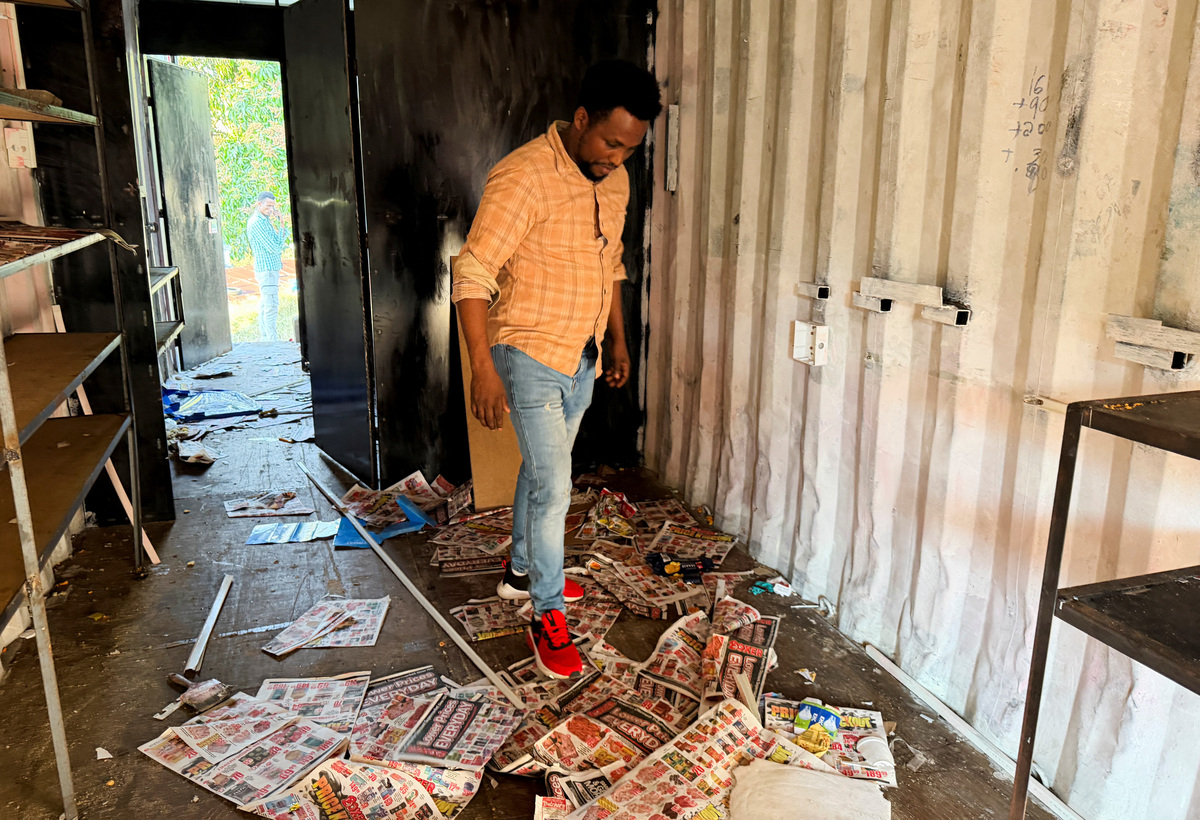 Ethiopian refugee Daniel Abide inspects his looted shop after xenophobic protests in kwaDabeka, Durban, South Africa, July 1, 2026. REUTERS/Siyabonga Sishi